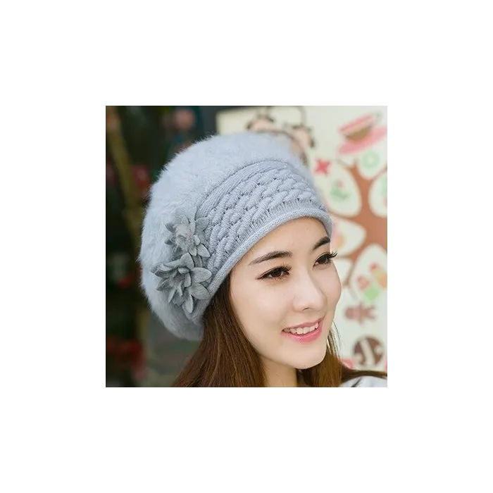 Knitted beret - a warm fur hat with decorative flowers