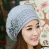 Knitted beret - a warm fur hat with decorative flowers
