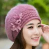 Knitted beret - a warm fur hat with decorative flowers