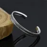Stainless steel bracelet - with leaf pattern - open design - unisex