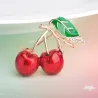 Elegant brooch with a red crystal cherry