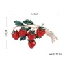 Elegant brooch with a sprig of strawberries