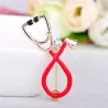 Stethoscope shaped brooch with crystal