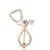 Stethoscope shaped brooch with crystal