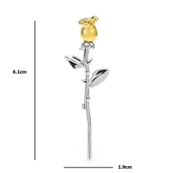 Elegant silver brooch with a golden rose