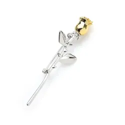 Elegant silver brooch with a golden rose