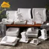 Elegant tableware - white porcelain dinner set - cups - saucers - platesCutlery