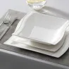 Elegant tableware - white porcelain dinner set - cups - saucers - platesCutlery
