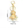 Golden crystal owl - green leaves - keychainKeyrings