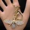 Golden keychain with a crystal beeKeyrings