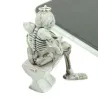 Skeleton sitting on the toilet - rubber keychainKeyrings