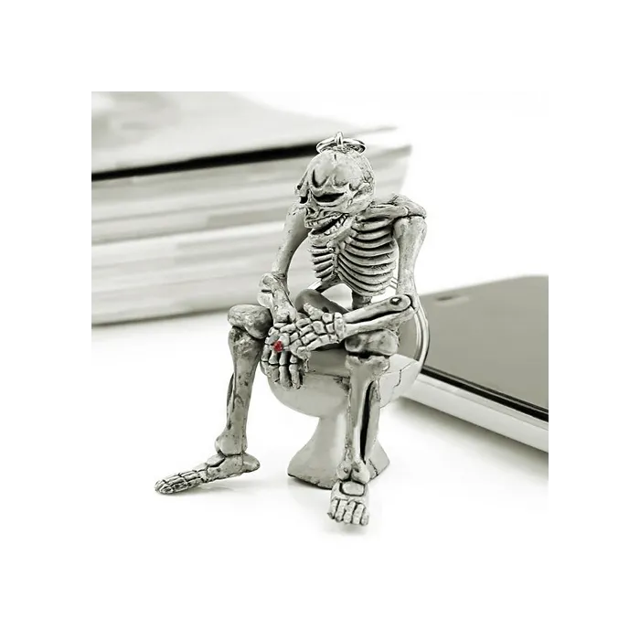 Skeleton sitting on the toilet - rubber keychainKeyrings