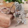 Skeleton sitting on the toilet - rubber keychainKeyrings