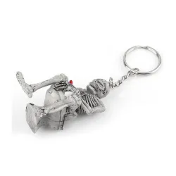 Skeleton sitting on the toilet - rubber keychainKeyrings