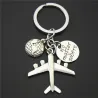Earth & airplane - silver keychainKeyrings