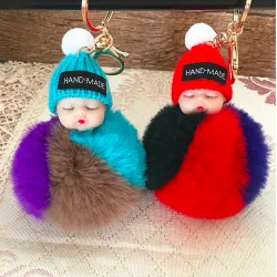Sleeping baby doll - keychain with fur pompom