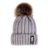 Warm winter wool hat with pom pom