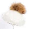 Elegant beret with fur pom-pom