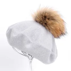 Elegant beret with fur pom-pom